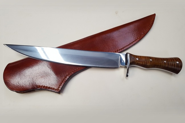 Read more: Hand Forged Long Camp Knife with Tiger Maple Handle
